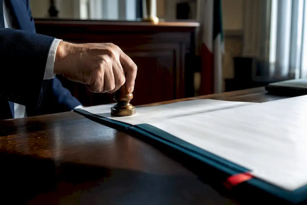Clerk applying Italian legalization stamp